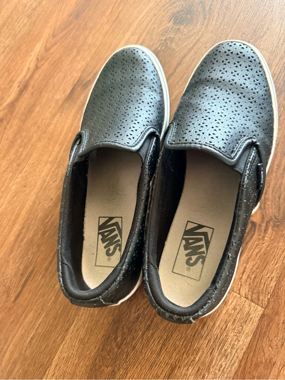 Vans Women's Black Perforated Slip-On Sneakers with White Midsole